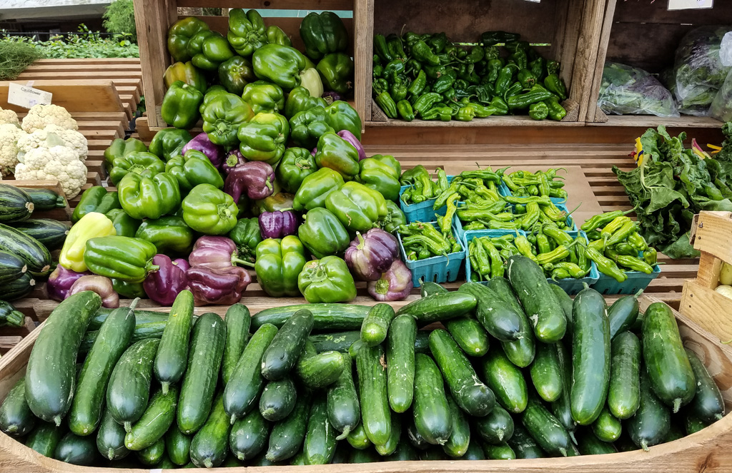 A picture of different vegetables at a vendor booth at the Edmonds Farmers Market