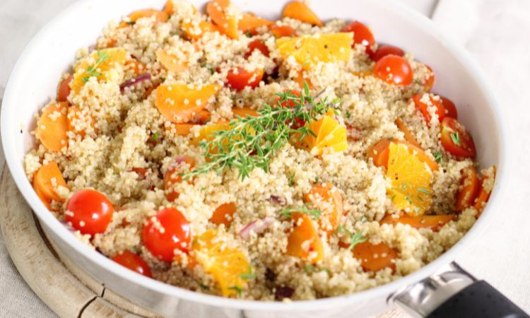 A Bowl of Quinoa with slice vegetables.
